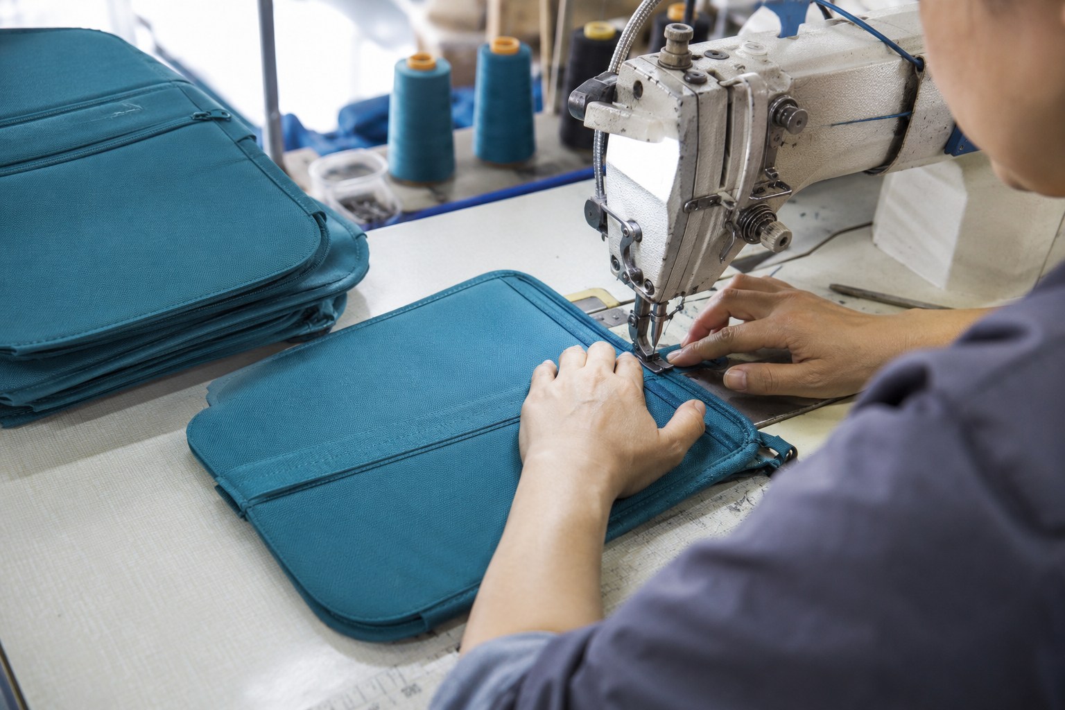 Main-body stitching visual for the Travelon Anti-Theft Classic Messenger Bag connected to durability and shape retention